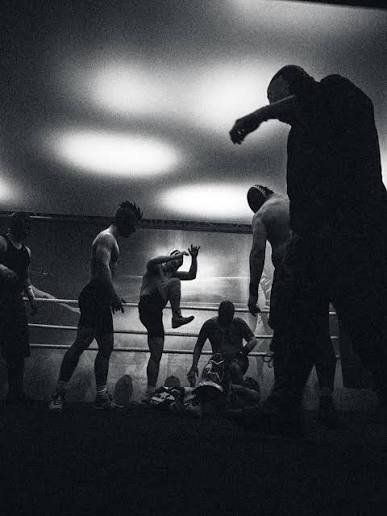 Wrestlers in the ring, backstage rehearsal