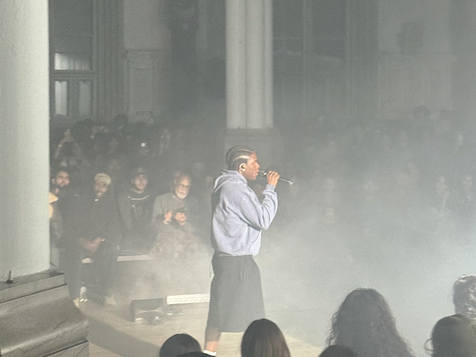 Daniel Caesar performing at the mic