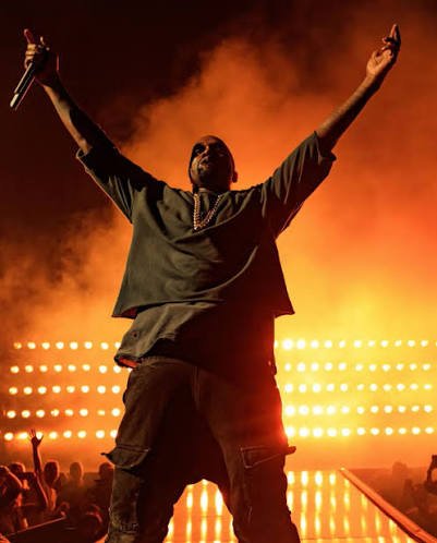 Kanye West performing on stage